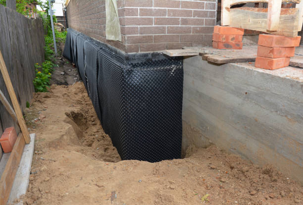 SJ Waterproofing Pros technician performing targeted Emergency Waterproofing assessment in Sharpsville, PA